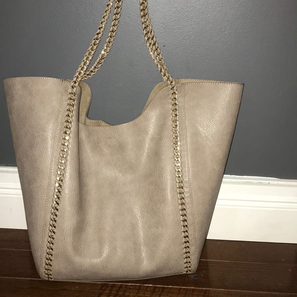 Beige tote with matching cosmetics bag